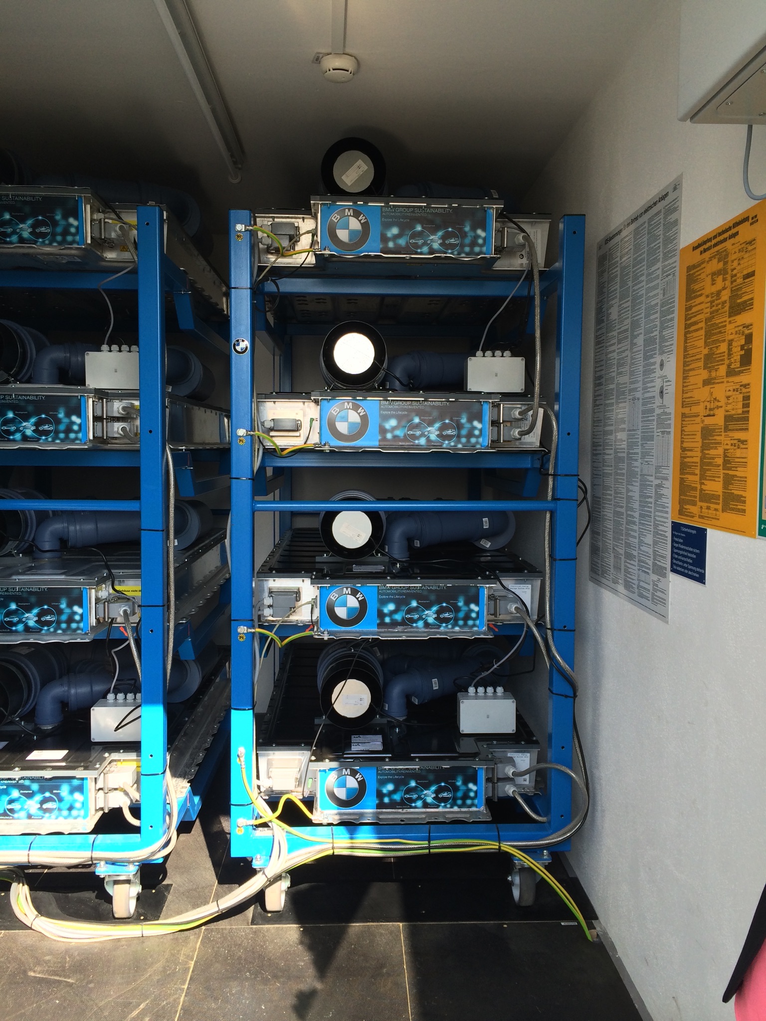 Racks of used EV battery packs repurposed as second-life energy storage