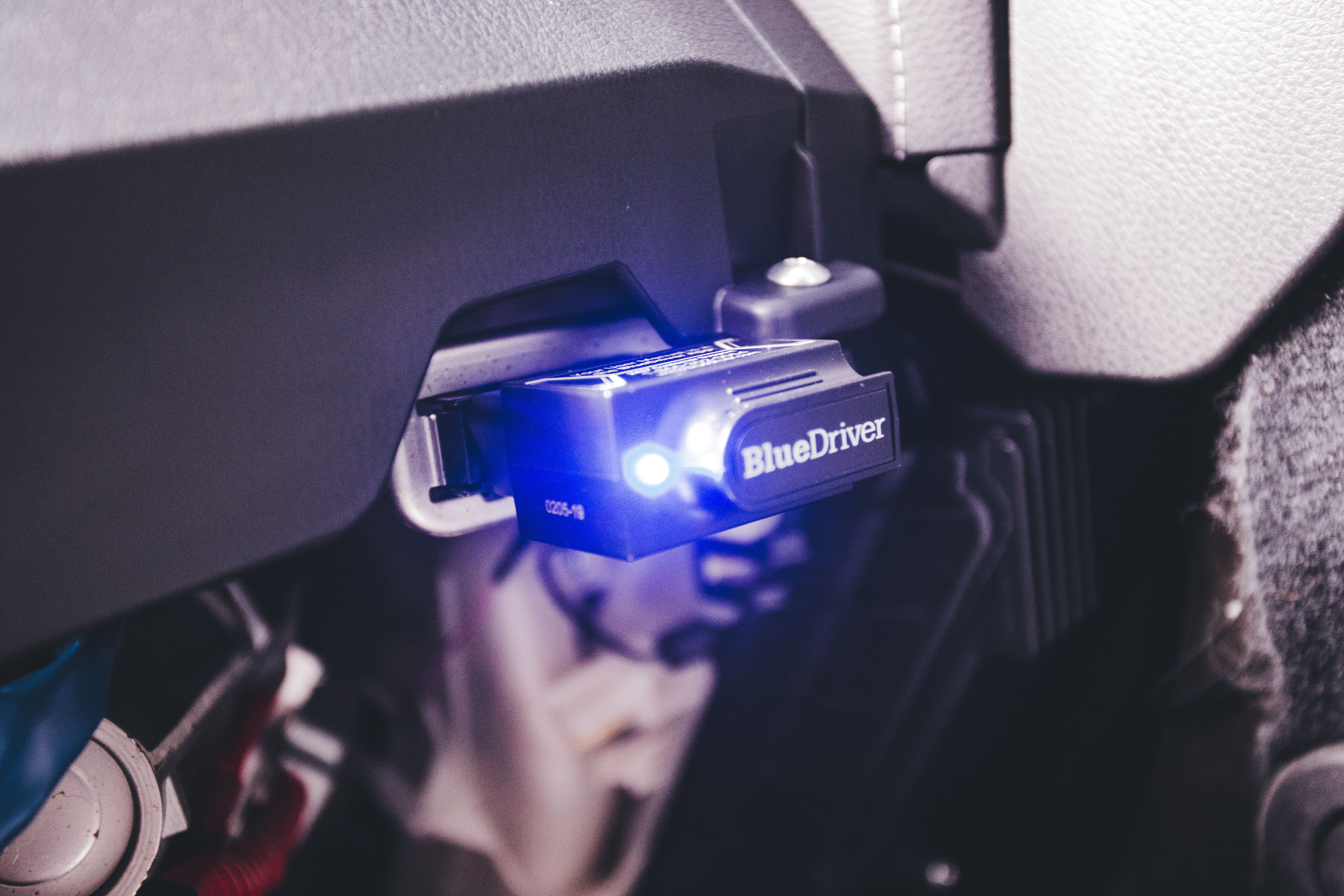 Diagnostic scanner plugged into a car's OBD-II port